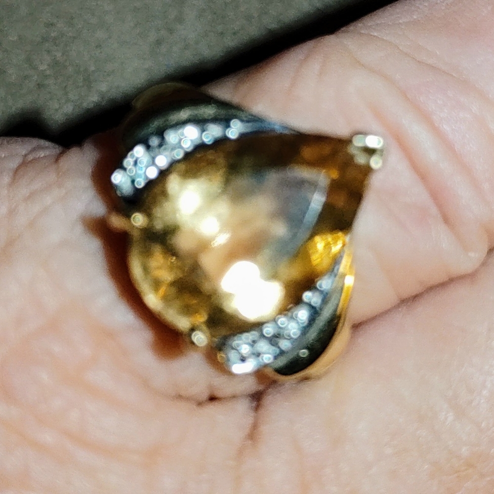 Amber topaz pear cut, set in 10k gold.